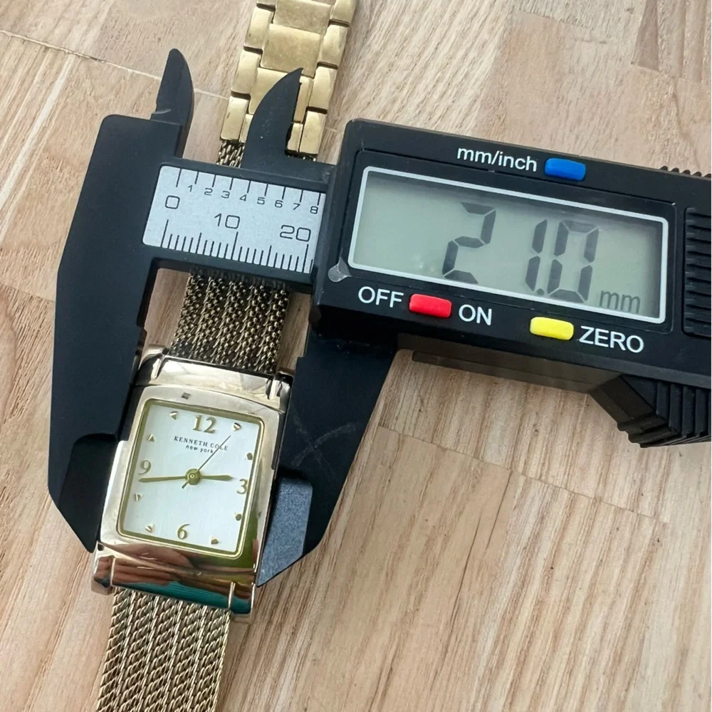 Kenneth Cole New York ladies rectangular gold tone dress watch NEW BATTERY